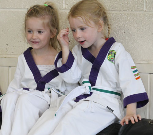 Martial Arts child demonstrating the relatedness part of self determination theory